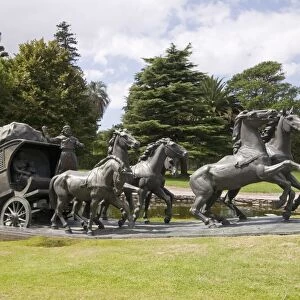 La Diligencia by Jose Belloni, a bronze statue of a stage coach and horses