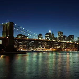 Manhattan skyline and Brooklyn Bridge at dusk