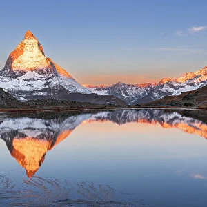 Matterhorn reflection in Riffelsee lake at sunrise, Gornergrat, Zermatt, canton of Valais, Switzerland, Europe