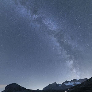 Milky Way and lights of car traces, Bernina Pass, Poschiavo Valley, Engadine, Canton of Graubunden