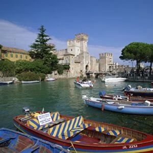Moored boats at Sirmione on Lake Garda, Lombardy, Italy, Europe