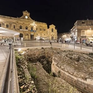 Night view of the Town Hall and ancient ruins in the medieval old town of Ostuni