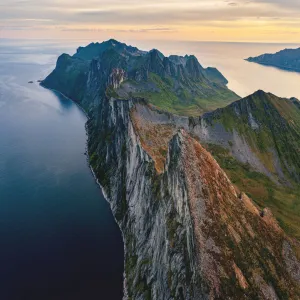 Panoramic of Segla, Hesten and Inste Kongen mountains at sunrise, Senja island