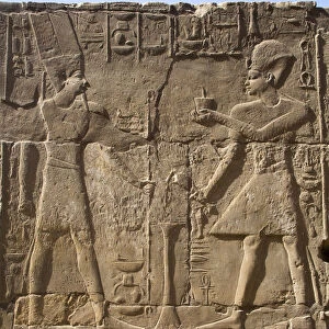 Pharaoh on right, God Amun on the left, Bas Relief, Luxor Temple