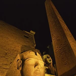 Ramses II and the Obelisk at Luxor Temple, illuminated at night, Luxor