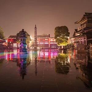 Reflections of LED lighting in the rain at Xiangji Temple, Hangzhou, Zhejiang, China, Asia