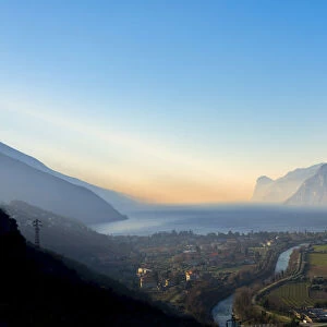 Riva del Garda at sunrise in winter, Lake Garda, Trentino, Dolomites, Italy, Europe