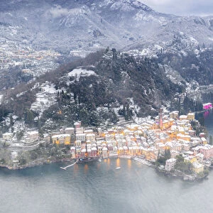 Romantic town of Varenna covered with snow, aerial view, Lake Como, Lecco province
