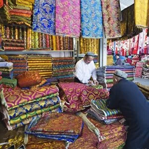 Silk fabrics being sold at the Sunday market, Kashgar (Kashi), Xinjiang Provice