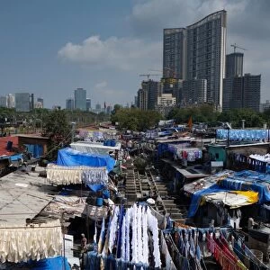 Slum washing ghats surrounded by expensive residential developments, Mumbai (Bombay)