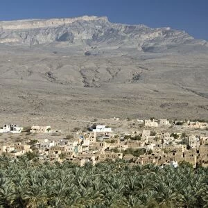 Small town beside its irrigated palmery, Al Hamra, at foot of mountain of Jabal Akhdar