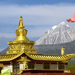 Snow mountain and Buddhist temple, Tagong Grasslands, Sichuan, China, Asia