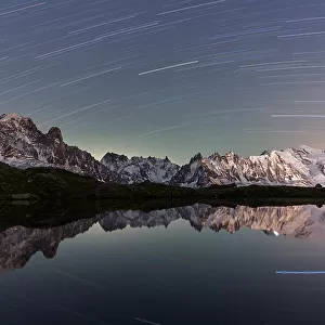 Star trail over Mont Blanc range seen from Lac de Cheserys, Chamonix, French Alps, Haute Savoie, France, Europe