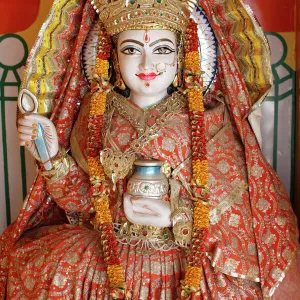 Statue of the Hindu goddess Annapurna (Parvati) giving food, Lakshman temple