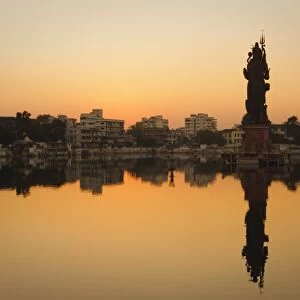 Statue of Shiva rising out of a Lake Sur Sagar in the centre of Vadodara, Gujarat, India, Asia