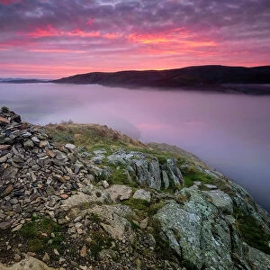 Summit Cairn on Yew Crag above misty Ullswater at sunrise, Gowbarrow Fell, Lake District National Park, UNESCO World Heritage Site, Cumbria, England, United Kingdom, Europe