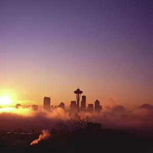 Sunrise over silhouette of Seattle skyline and Mt. Rainier, Seattle, Washington