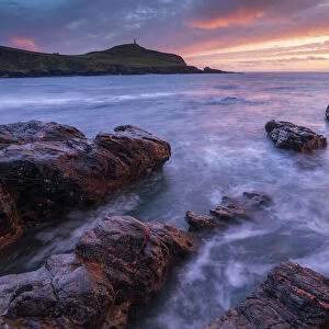 Sunset over Cape Cornwall from the rocky shores of Porth Ledden, Cornwall, England, United Kingdom, Europe