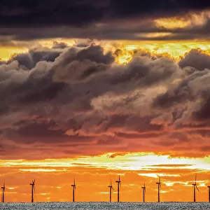 Sunset view from Walney Island across the Irish Dea towards the distant Walney Offshore Wind Farm, Cumbrian Coast, Cumbria, England, United Kingdom, Europe