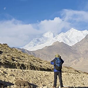 Trekker taking a photo on the Annapurna circuit trek