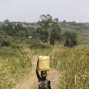Ugandan child fetching water, Masindi, Uganda, Africa
