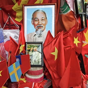 Vietnamese flags and portraits of Ho Chi Minh in a tourist shop