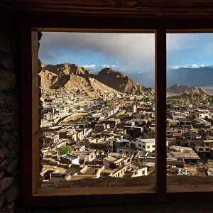 View through the frame of a window onto the skyline of Leh, Ladakh, Himalayas, northern India, Asia