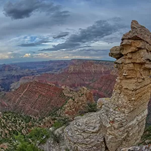 View of Grand Canyon and a rock spire from within a gap between a stack of balanced boulders at Grandview Point, Grand Canyon National Park, UNESCO World Heritage Site, Arizona, United States of America, North America