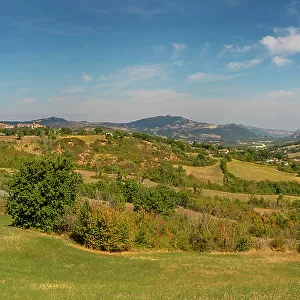View of trees and countryside towards San Leo, Province of San Rimini, Emilia-Romagna, Italy, Europe