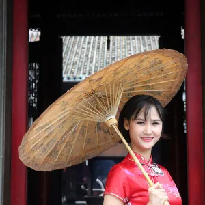 Woman wearing Vietnamese tradition dress called Ao Dai, Taoist temple