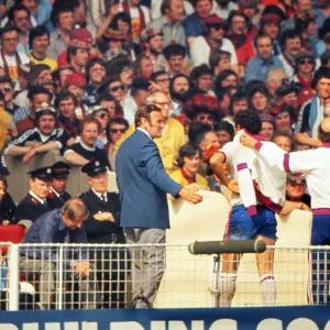 England manager Don Revie comes off the bench to meet Ray Kennedy after his substitution against Scotland- 1977 British Home Championship