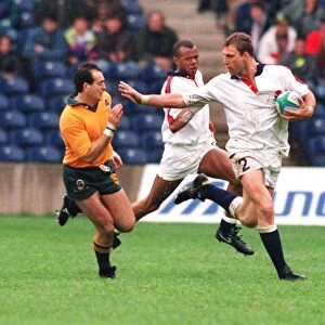 Lawrence Dallaglio hands off David Campese at the 1993 World Sevens