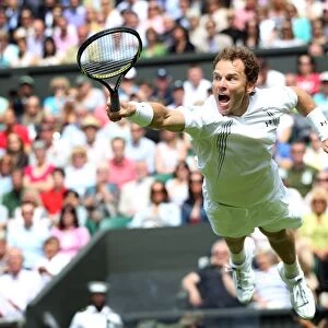 Michael Russell dives to return a shot during the 2011 Wimbledon Championships