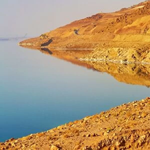 Barren shoreline and salt water of the Dead Sea, Jordan