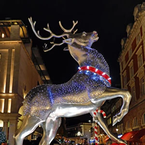 Christmas lights switched on in Covent Garden Market, London