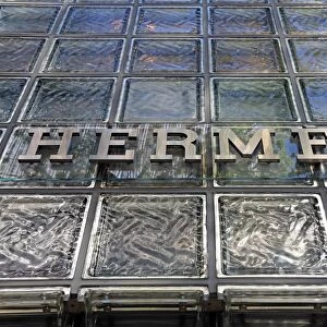 Glass front and logo on the Japanese Hermes shop building in Ginza, Tokyo, Japan