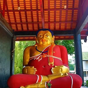 Statue of the fat Monk Tan Pra Maha Kajjana at Wat Chedi Luang Temple in Chiang Mai, Thailand