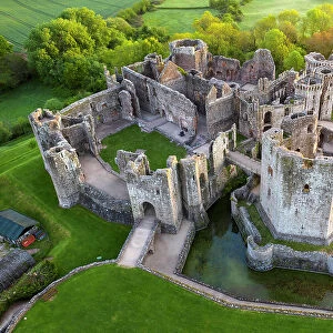 Aerial view of Raglan Castle in the county of Monmouthshire, Wales, UK. Spring (May) 2022