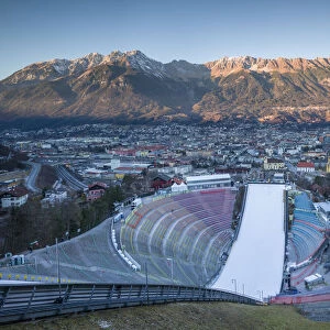 Austria, Tyrol, Innsbruck, ski jump and city view at sunset from the Bergeisel, Olympic