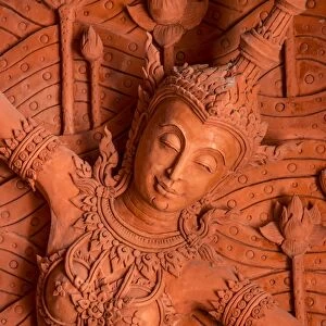 Bas-reliefs on the walls of Wat Ratchathammaram, Koh Samui, Thailand