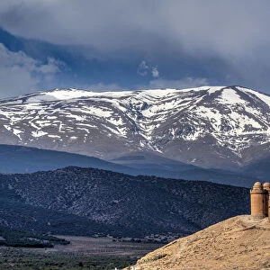 Castillo de la Calahorra castle with the Sierra Nevada mountain range in the background