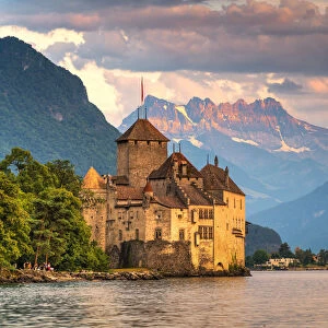 Chillon Castle (Chateau de Chillon) on shores of Lake Geneva with the Alps in background, Montreux, Canton‎ ‎of Vaud, Switzerland