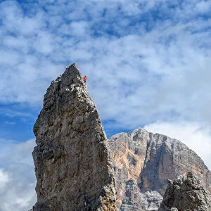 Climber on Cinque Torri (Tofane on background), Cortina d Ampezzo, Belluno district