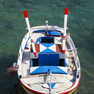Colourful traditional fishingboat in the small village of Mandraki on the island of Milos