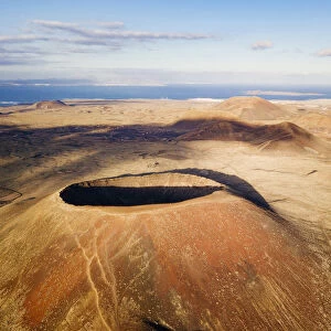 el Calderon Hondo, Volcano in Fuerteventura, ocean in background