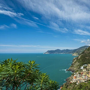 Europe, Italy, Liguria. View over the Cinque Terre coast with the village of Riomaggiore