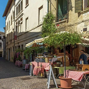 Europe, Italy, Veneto. Asolo, a street with a typical enoteca offering wine and panini