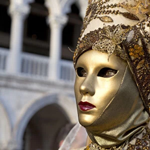 Golden mask and costume at the Carnival, Piazza San Marco (St. Marks Square)