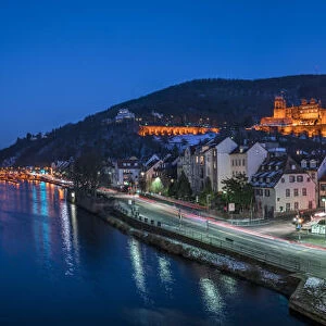 Heidelberg castle and Old Bridge at dusk alongside the Neckar river, Baden-Wurttemberg
