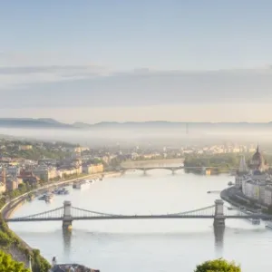 Hungary, Central Hungary, Budapest. Sunrise over Budapest and the Danube from Gellert